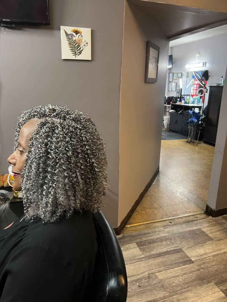 Shoulder-length salt-and-pepper crochet curls