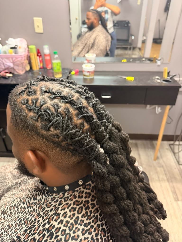 Barrel-twist loc style finished into a ponytail