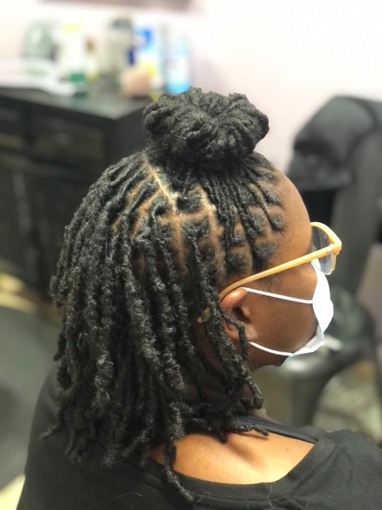 Half-up loc bun style