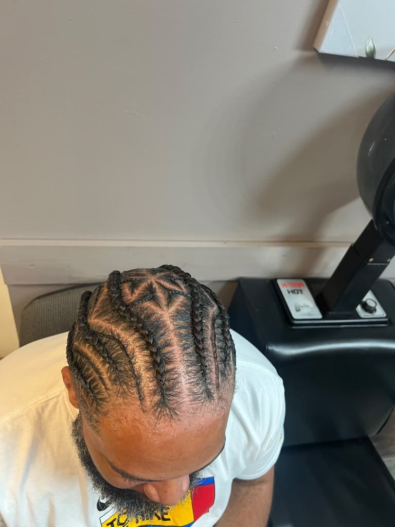 Men's stitch cornrows in a curved design